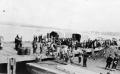troop truck on dock likely for German prisoners B